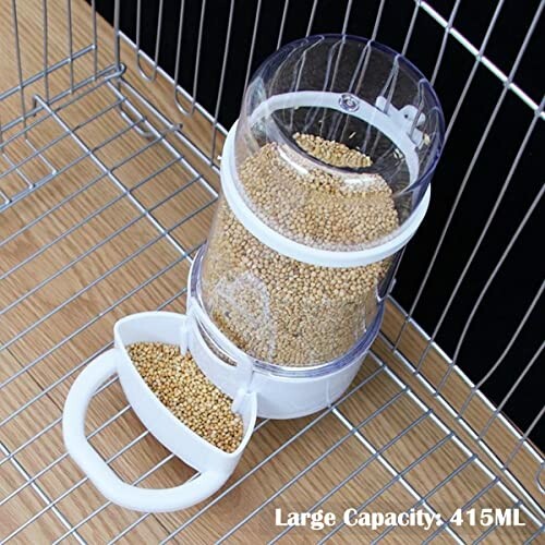 Transparent bird feeder with 415ml seed capacity on wire shelf.